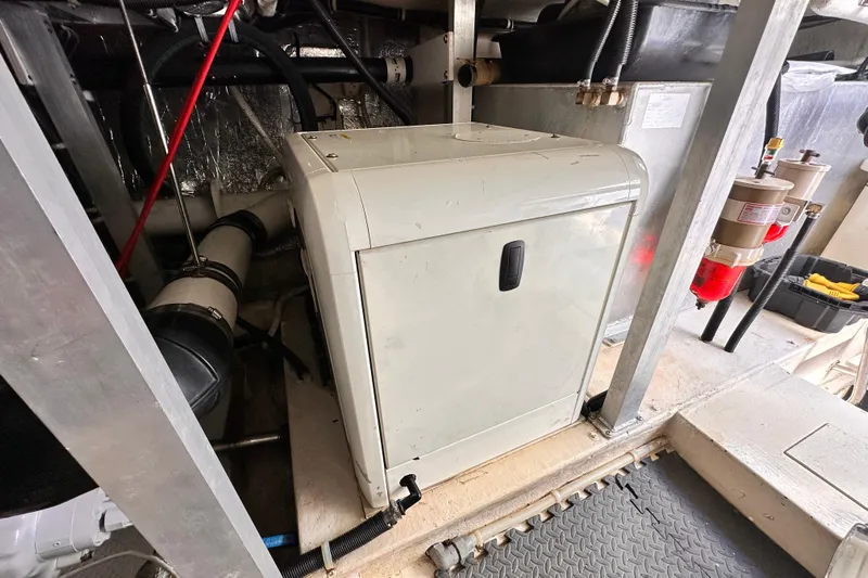 Barkruiser Yacht Photos Pics Engine room of 1998 Navigator 4800 yacht with machinery and equipment.