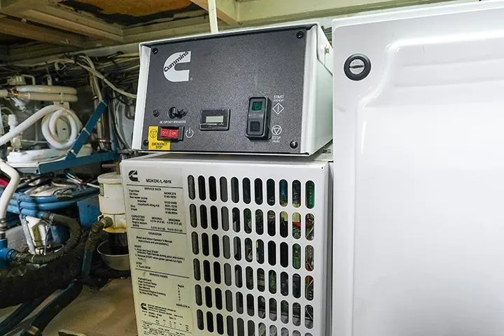 Impulse Yacht Photos Pics Engine room of 1987 Viking Palm Beach boat with Cummins generator.