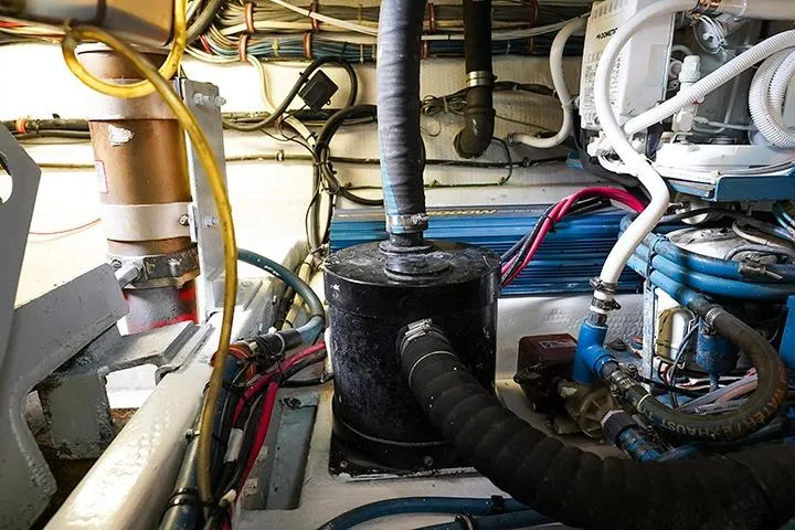 Impulse Yacht Photos Pics Engine room of a 1987 Viking Palm Beach boat, showcasing complex wiring and machinery.