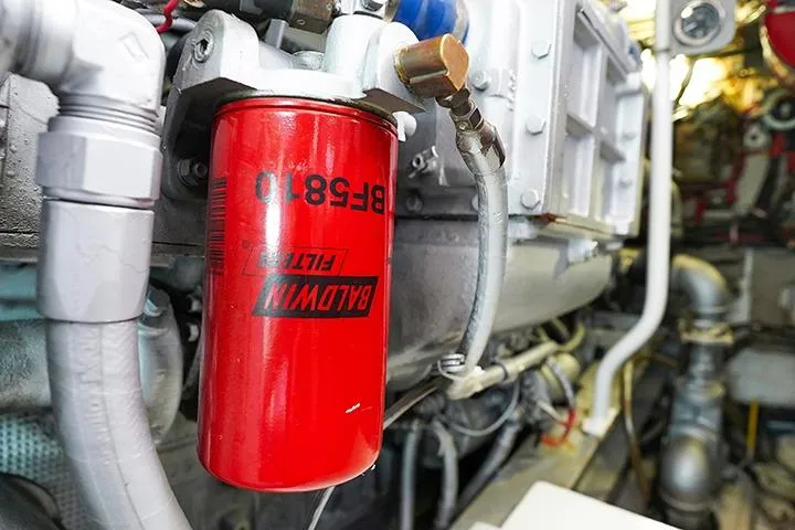 Impulse Yacht Photos Pics Red Baldwin filter in 1987 Viking Palm Beach engine room.