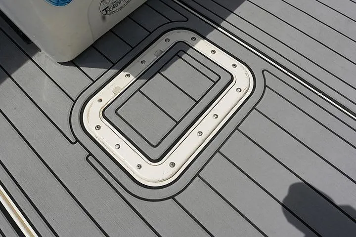 Impulse Yacht Photos Pics 1987 Viking Palm Beach boat deck with hatch, featuring sleek gray lines and durable design.