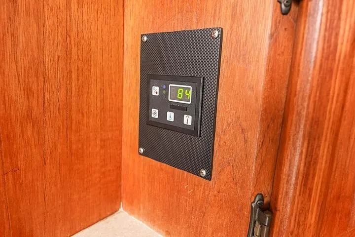 Impulse Yacht Photos Pics Control panel on 1987 Viking Palm Beach boat with wooden interior.