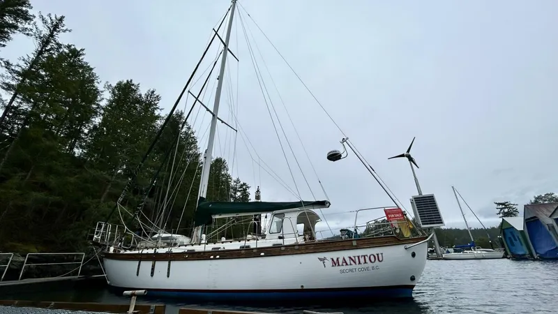  Yacht Photos Pics Sailboat "Manitou" docked, Custom Seawing-Atkins model, 2002, with trees in the background.