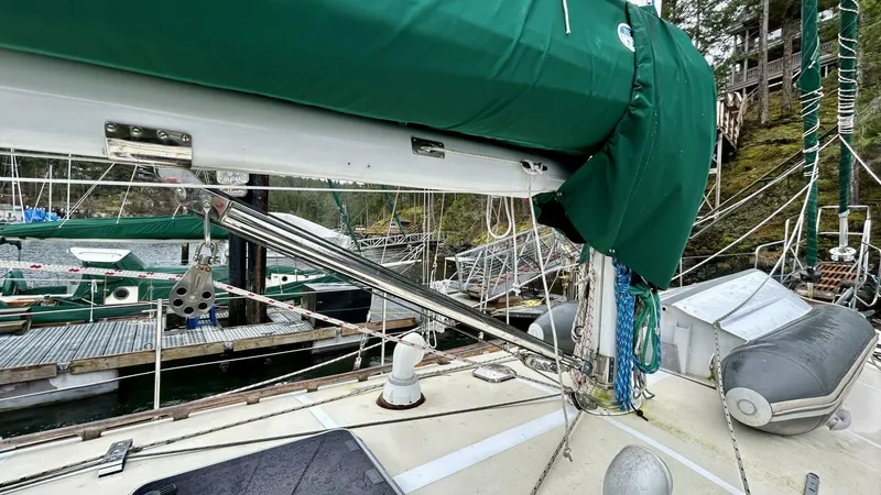  Yacht Photos Pics Sailboat deck with green cover, Custom Seawing-Atkins 2002, docked at marina.