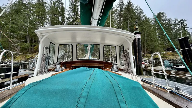  Yacht Photos Pics Sailboat cockpit view, Custom Seawing-Atkins 2002, docked in a forested marina.