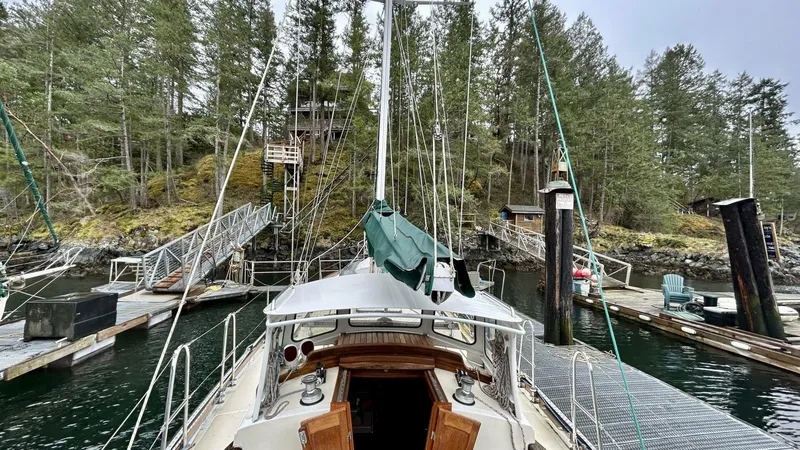  Yacht Photos Pics Sailboat docked in a forested marina, Custom Seawing-Atkins 2002 model.