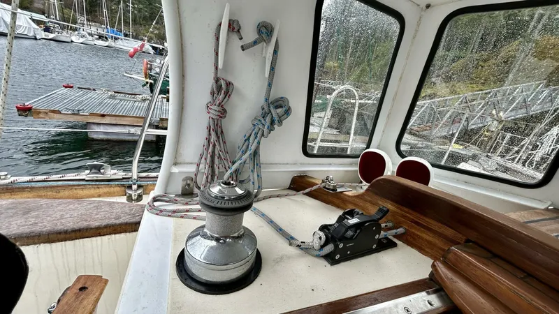  Yacht Photos Pics Cockpit of 2002 Custom Seawing-Atkins boat with winch and ropes, docked at marina.