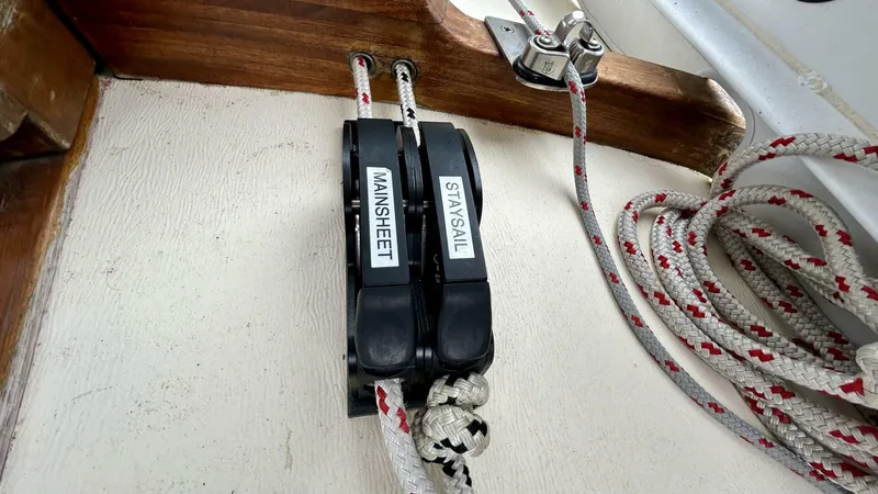  Yacht Photos Pics Sailing ropes labeled "Mainsheet" and "Staysail" on a 2002 Custom Seawing-Atkins boat.