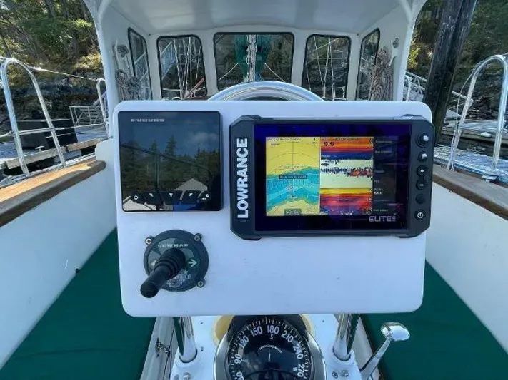  Yacht Photos Pics Boat cockpit with navigation equipment, including Lowrance Elite display, on a 2002 Custom Seawing-Atkins.