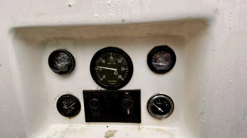  Yacht Photos Pics Instrument panel of 2002 Custom Seawing-Atkins boat with gauges and controls.