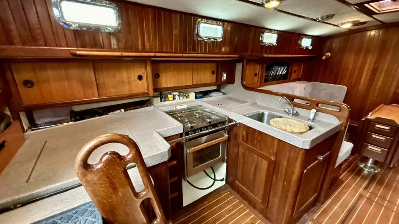  Yacht Photos Pics Luxurious wooden yacht kitchen interior with modern appliances, Custom Seawing-Atkins 2002 model.