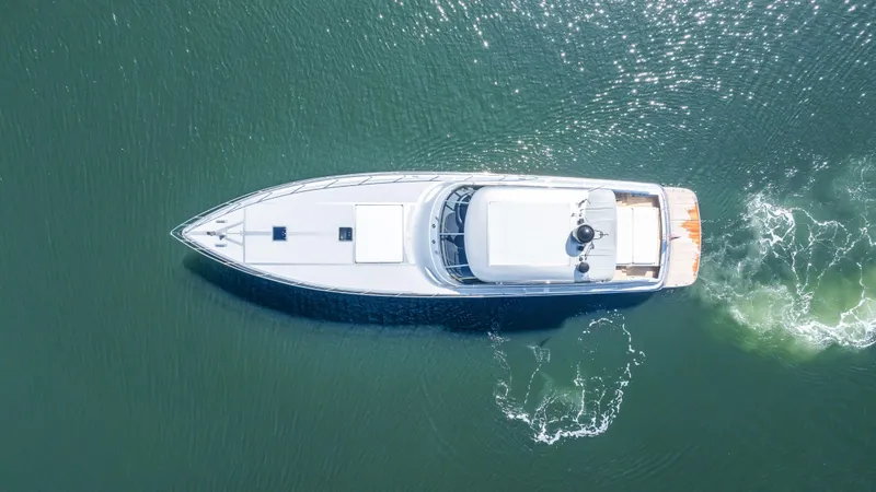 Alchemy Yacht Photos Pics Aerial view of 2003 Baia PANTHER 80 yacht cruising on water.