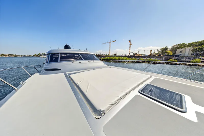 Alchemy Yacht Photos Pics Luxury 2003 Baia Panther 80 yacht on calm water, sunny day.