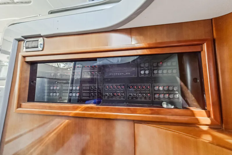 Alchemy Yacht Photos Pics Control panel of a 2003 Baia PANTHER 80 yacht with wooden frame.