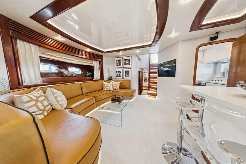 Alchemy Yacht Photos Pics Luxurious interior of 2003 Baia Panther 80 yacht with modern furnishings and elegant design.