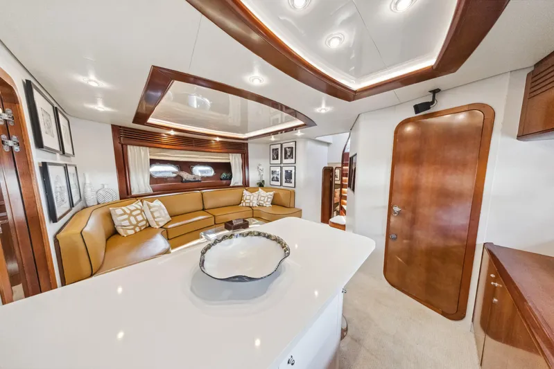 Alchemy Yacht Photos Pics Luxurious interior of 2003 Baia PANTHER 80 yacht with elegant seating and modern design.