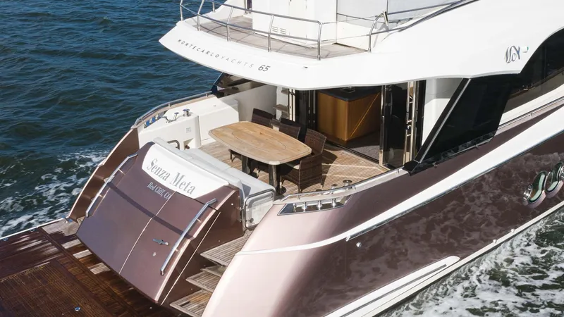 Nauti Style Yacht Photos Pics 2016 Monte Carlo Yachts MCY 65 luxury yacht cruising on the water.