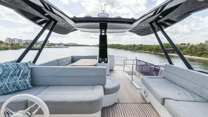 Nauti Style Yacht Photos Pics Luxurious 2016 Monte Carlo Yachts MCY 65 with spacious deck and elegant seating.