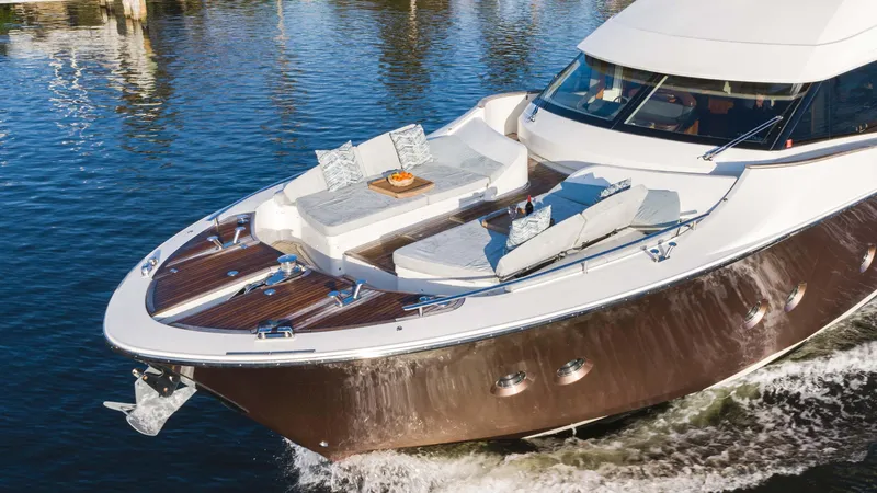 Nauti Style Yacht Photos Pics Luxurious 2016 Monte Carlo Yachts MCY 65 cruising on serene waters.