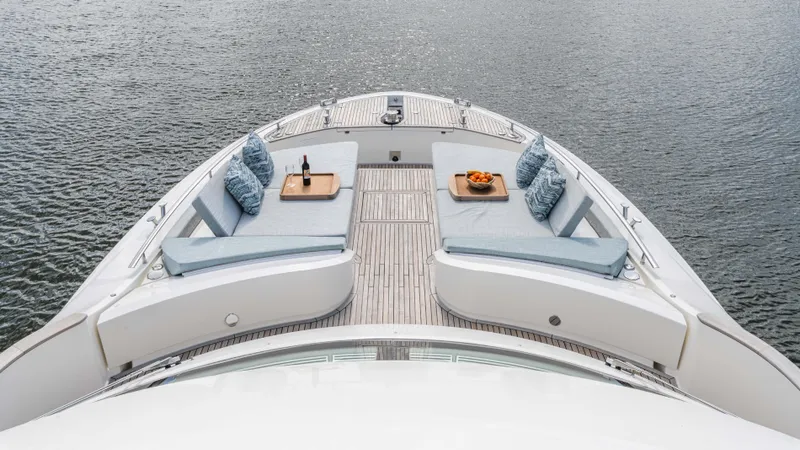 Nauti Style Yacht Photos Pics Luxurious 2016 Monte Carlo Yachts MCY 65 deck with elegant seating and refreshments.
