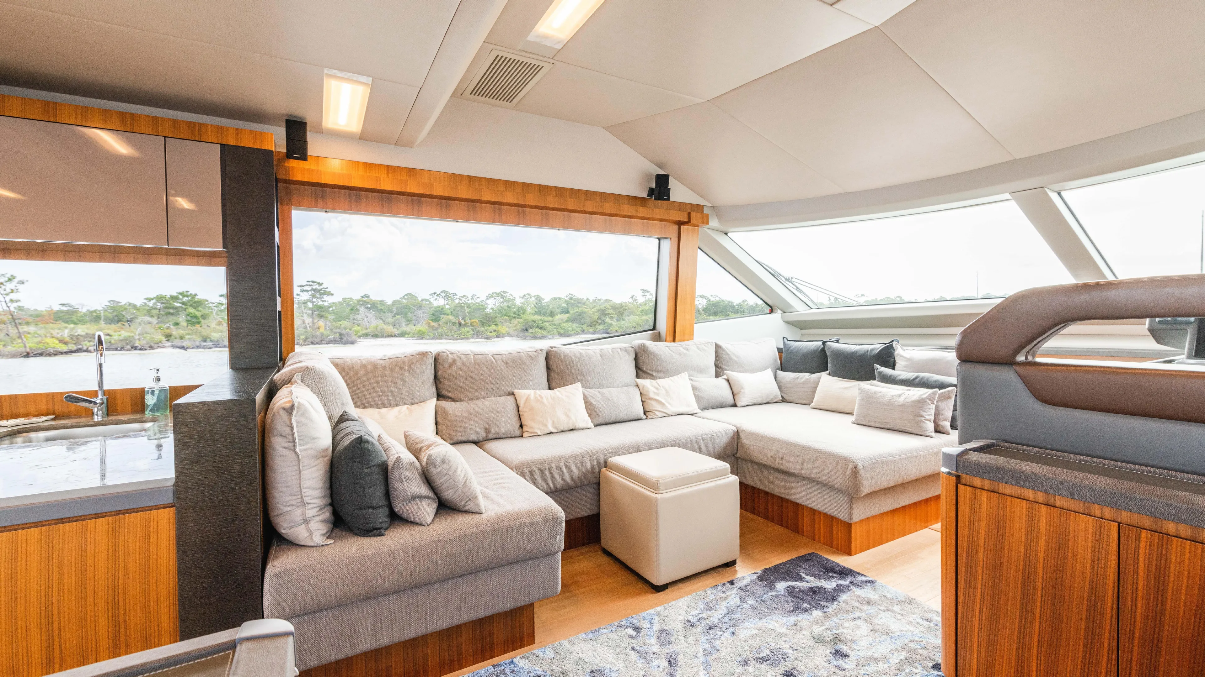 Nauti Style Yacht Photos Pics Luxurious interior of 2016 Monte Carlo Yachts MCY 65 with plush seating and modern design.