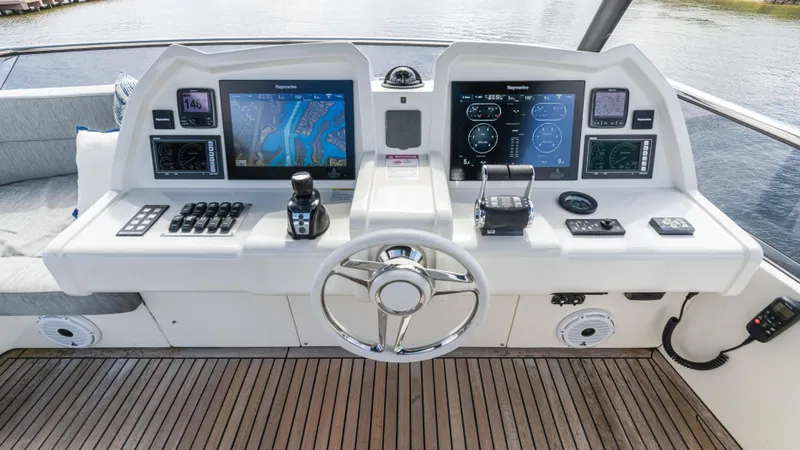 Nauti Style Yacht Photos Pics Helm of 2016 Monte Carlo Yachts MCY 65 with advanced navigation displays and controls.