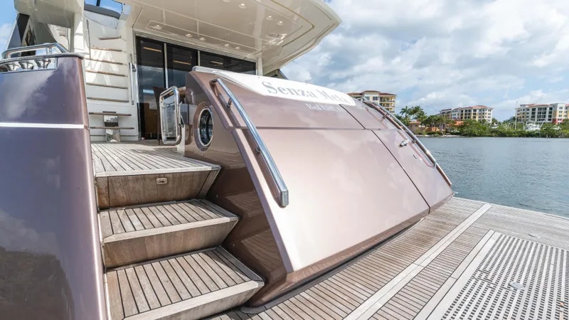 Nauti Style Yacht Photos Pics 2016 Monte Carlo Yachts MCY 65, elegant deck view with waterfront backdrop.