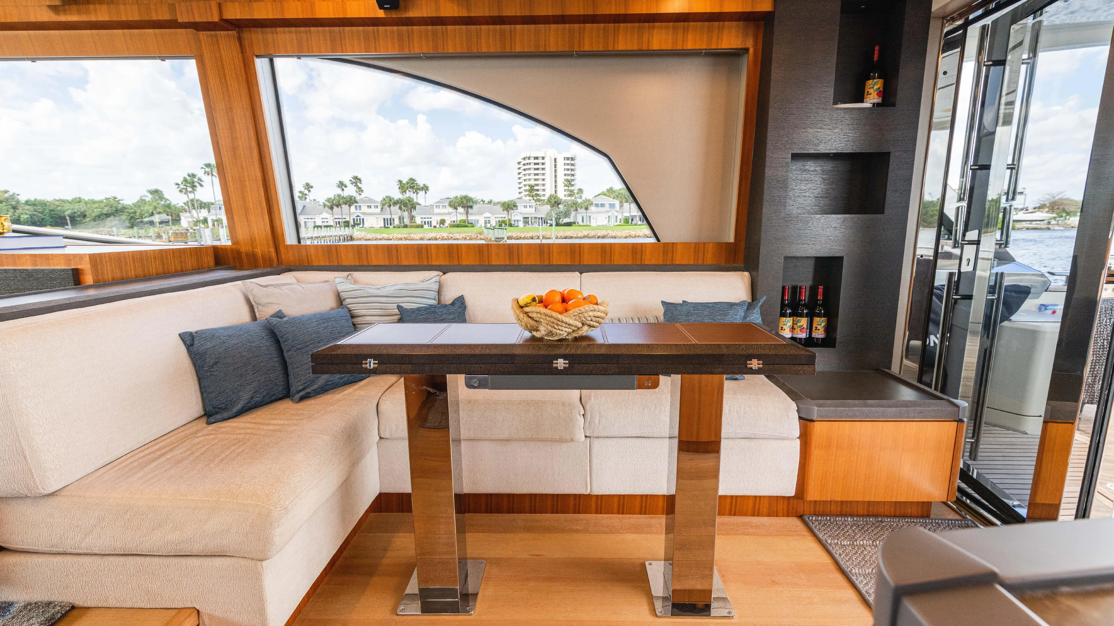 Nauti Style Yacht Photos Pics Luxurious interior of 2016 Monte Carlo Yachts MCY 65 with elegant seating and dining area.