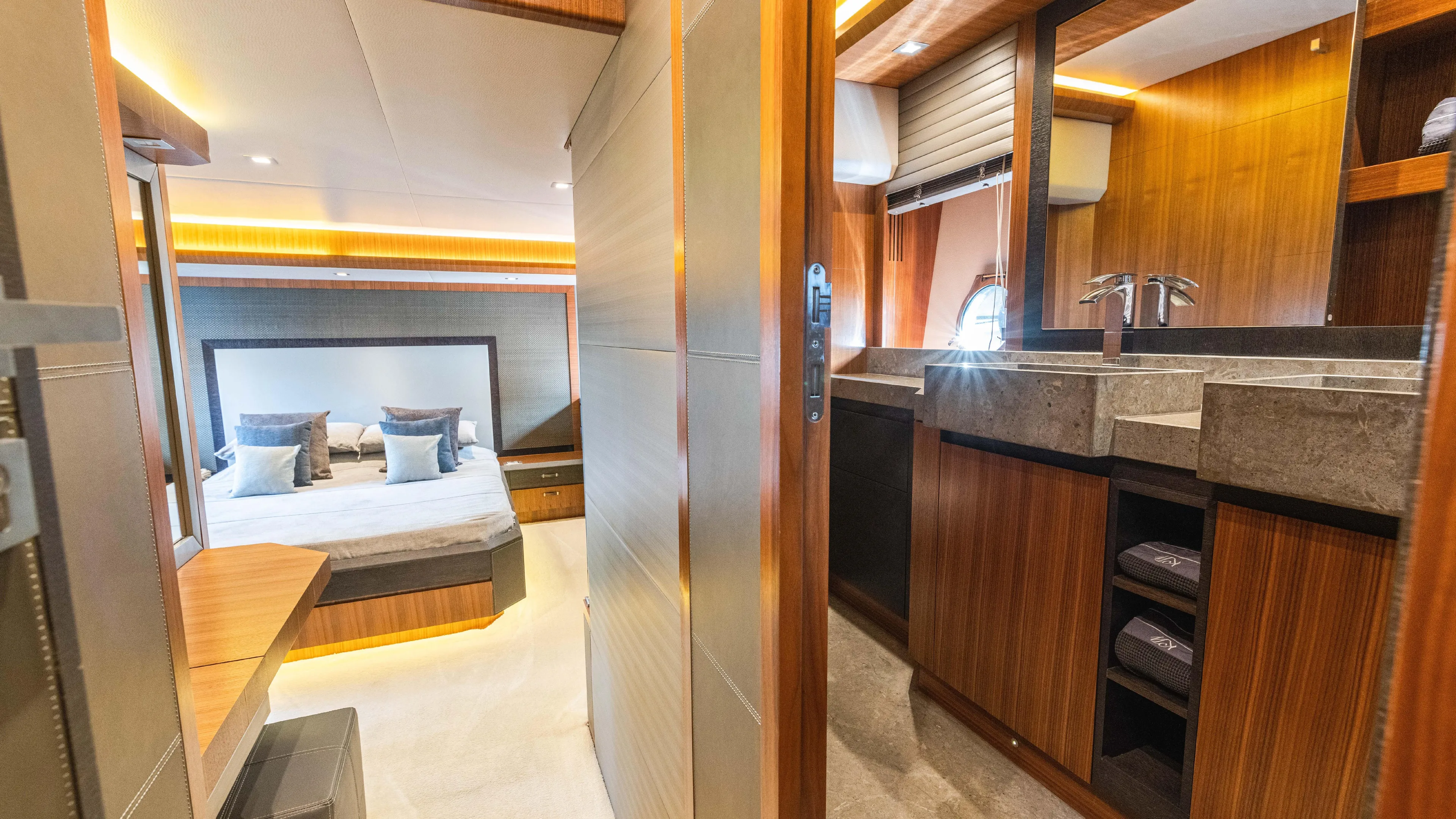 Nauti Style Yacht Photos Pics Luxurious interior of 2016 Monte Carlo Yachts MCY 65, featuring bedroom and bathroom.