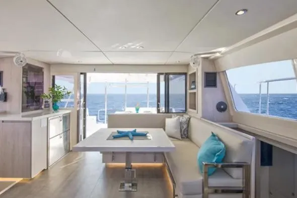 Andiamo Yacht Photos Pics Interior of 2020 Leopard 43 Powercat yacht with modern dining area and ocean view.