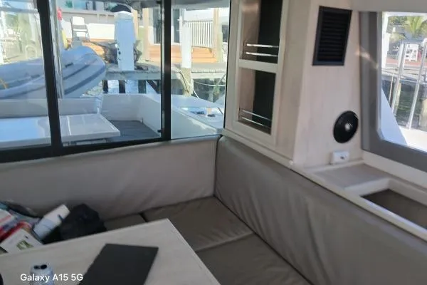 Andiamo Yacht Photos Pics Interior of 2020 Leopard 43 Powercat with seating and window view of marina.