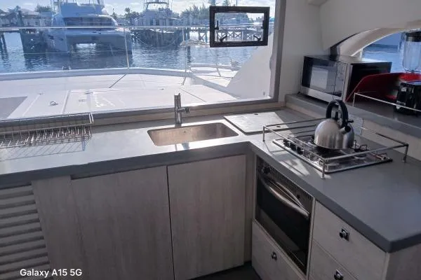 Andiamo Yacht Photos Pics Modern kitchen in a 2020 Leopard 43 Powercat yacht with ocean view.
