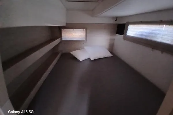 Andiamo Yacht Photos Pics Cozy cabin interior of 2020 Leopard 43 Powercat with bed and pillows.