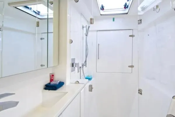 Andiamo Yacht Photos Pics Modern bathroom interior of 2020 Leopard 43 Powercat yacht, featuring sleek design and fixtures.