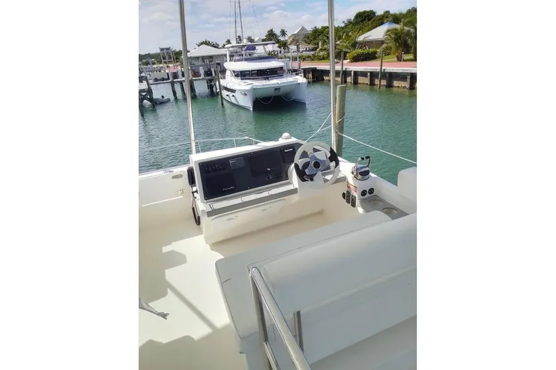 Andiamo Yacht Photos Pics Helm of 2020 Leopard 43 Powercat overlooking marina with docked boats.