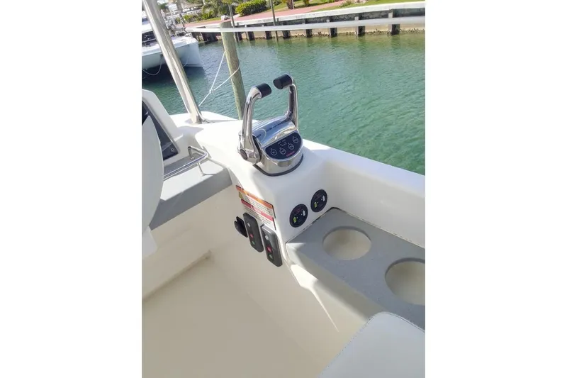 Andiamo Yacht Photos Pics Control panel of 2020 Leopard 43 Powercat with throttle and cup holders.
