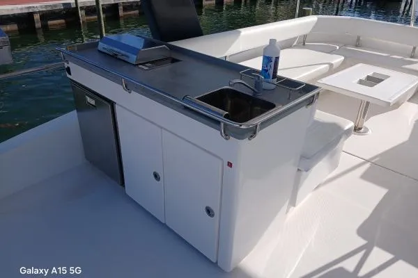 Andiamo Yacht Photos Pics Outdoor kitchen on 2020 Leopard 43 Powercat yacht with sink and grill.