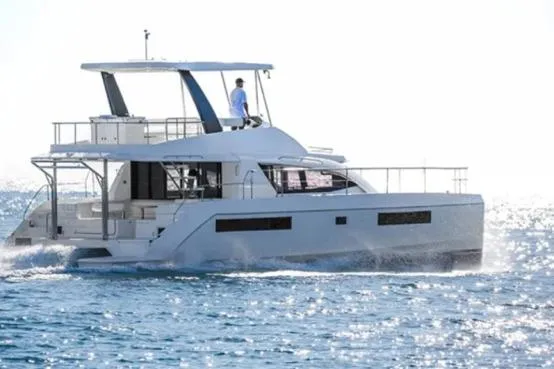 Andiamo Yacht Photos Pics 2020 Leopard 43 Powercat cruising on open water under clear skies.