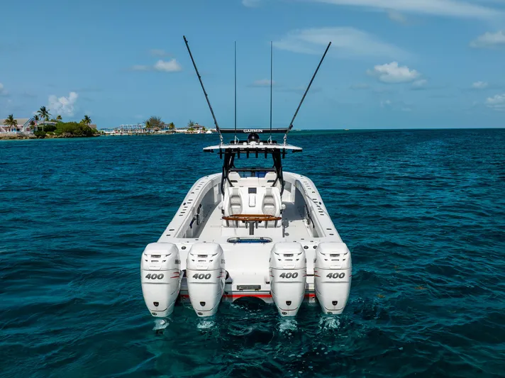  Yacht Photos Pics 2022 Freeman 37 VH boat with four engines on clear blue water.