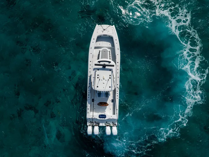  Yacht Photos Pics Aerial view of 2022 Freeman 37 VH boat on turquoise ocean waters.