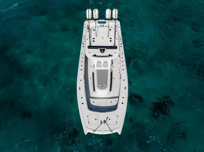  Yacht Photos Pics Aerial view of 2022 Freeman 37 VH boat on clear turquoise water.