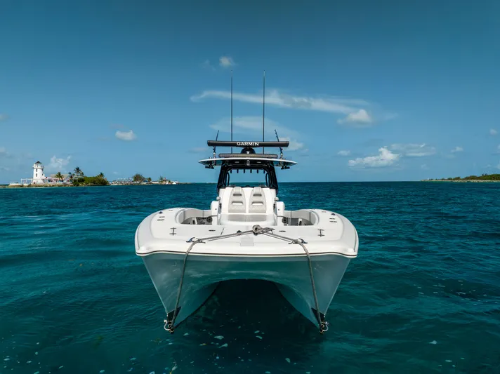  Yacht Photos Pics 2022 Freeman 37 VH boat on clear blue ocean near a small island.