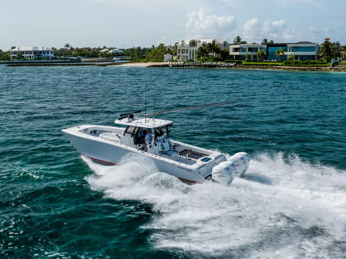  Yacht Photos Pics 2022 Freeman 37 VH boat cruising near luxury waterfront homes.