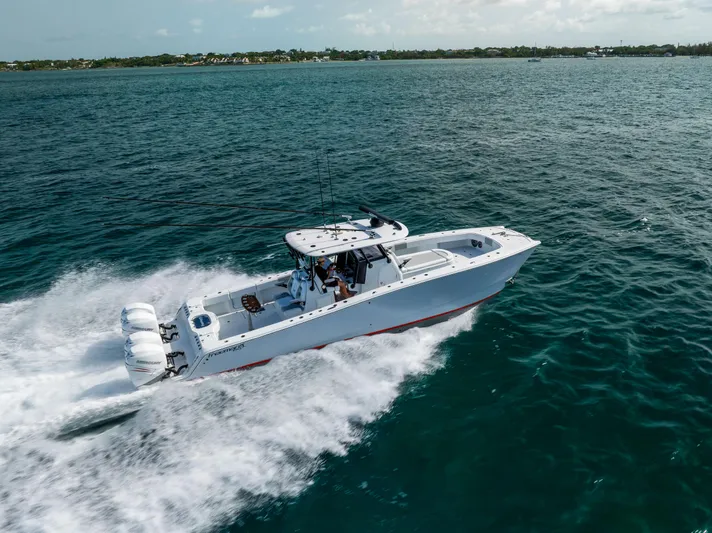  Yacht Photos Pics 2022 Freeman 37 VH boat speeding on open water, showcasing powerful engines and sleek design.