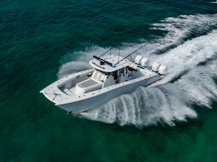  Yacht Photos Pics Freeman 37 VH 2022 boat cruising on clear turquoise water, aerial view.