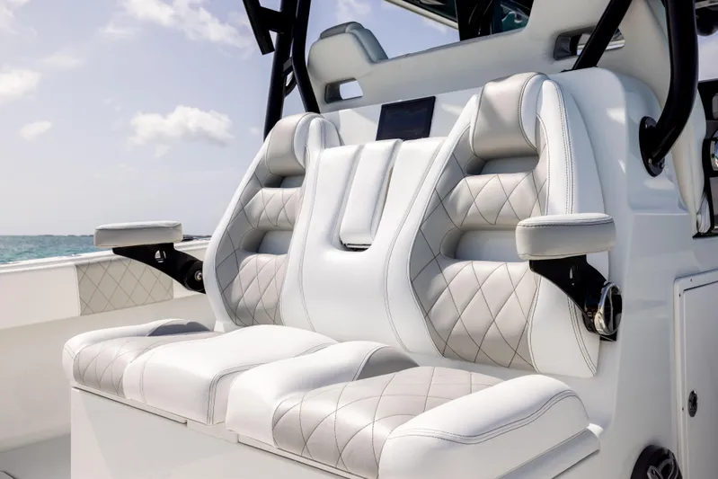  Yacht Photos Pics Luxurious seating on 2022 Freeman 37 VH boat, featuring diamond-stitched upholstery and armrests.