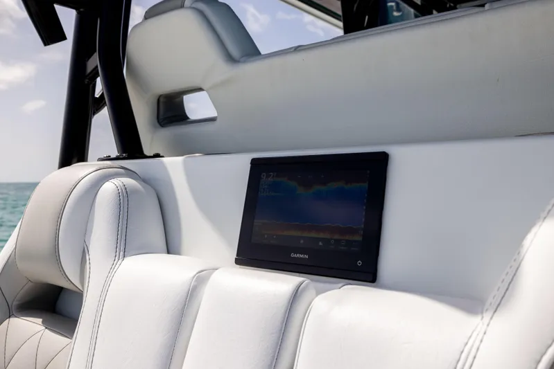  Yacht Photos Pics Freeman 37 VH 2022 boat interior with Garmin display on white seating.