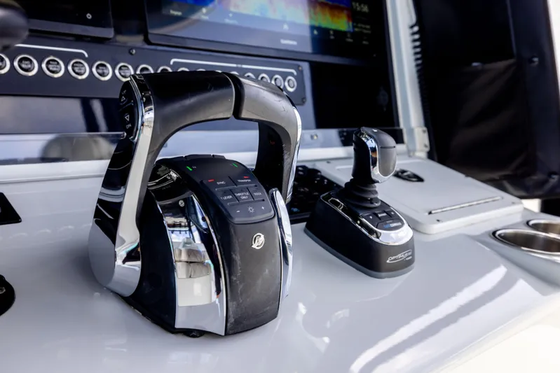  Yacht Photos Pics Control panel of a 2022 Freeman 37 VH boat with throttle and joystick.