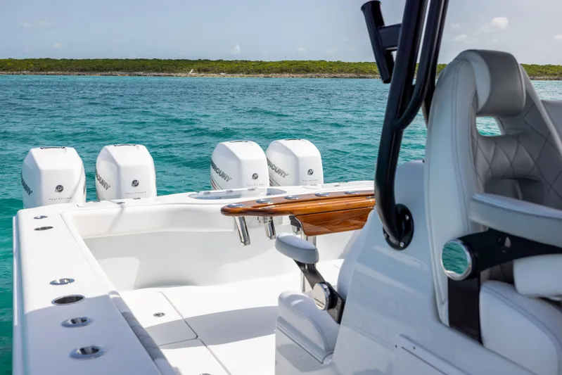  Yacht Photos Pics 2022 Freeman 37 VH boat with four Mercury engines on turquoise water.