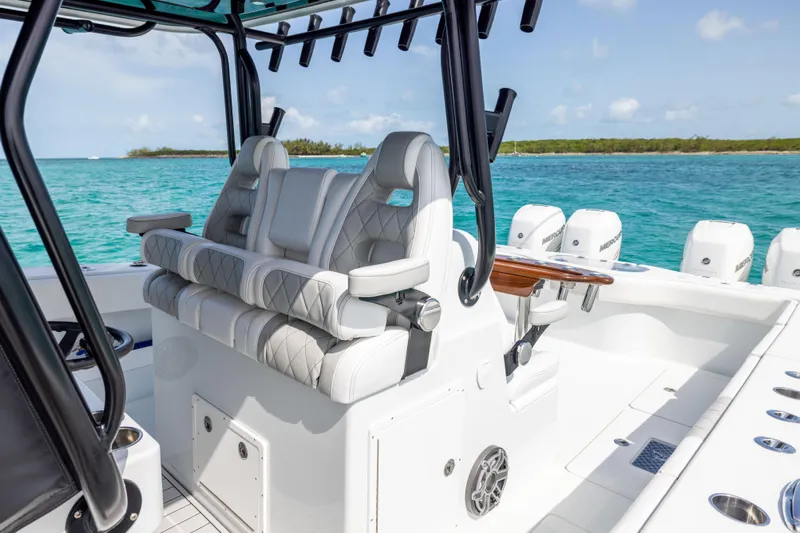  Yacht Photos Pics Luxury seating on a 2022 Freeman 37 VH boat, with ocean backdrop.